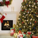 Christmas tree with presents and fireplace with stockings